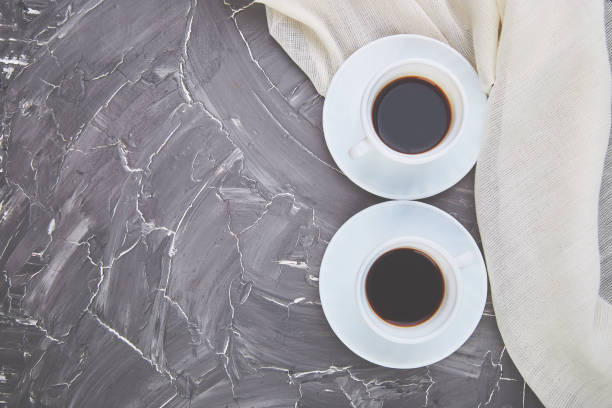 istock Two white cups of espresso on grey grunge background. 1141205545