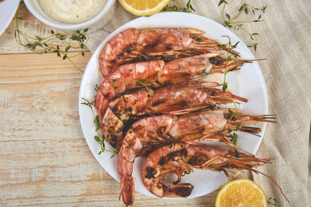 istock Grilled big tiger shrimps prawns on white plate 1141206097