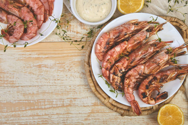 istock Grilled big tiger shrimps prawns on white plate 1141206101
