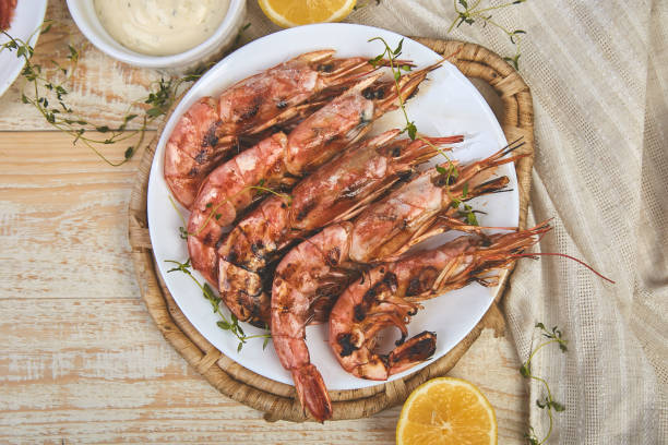 istock Grilled big tiger shrimps prawns on white plate 1141206105