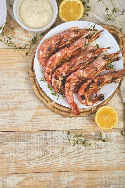 istock Grilled big tiger shrimps prawns on white plate 1141206108
