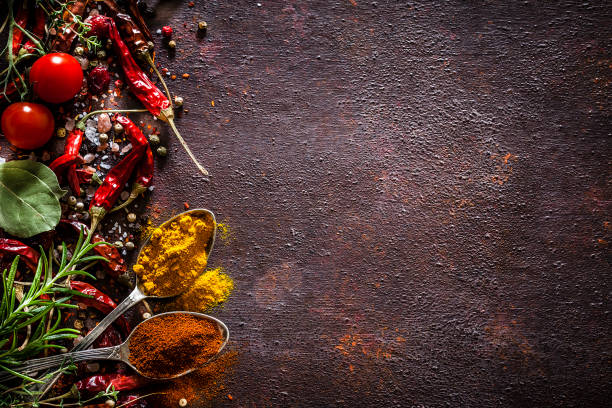 istock Spices and herbs frame shot from above on rustic brown table 1141208071