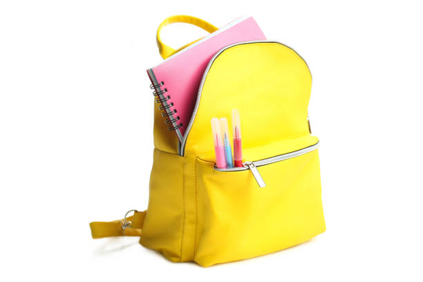yellow backpack with different school supplies - chancellery imagens e fotografias de stock