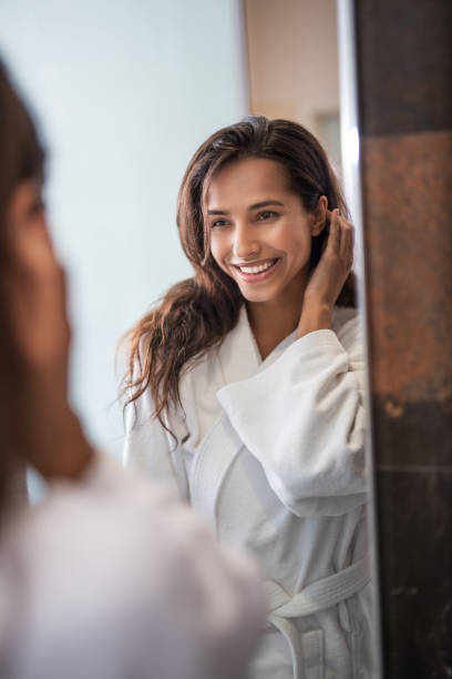 istock Positive girl looking at mirror 1141208995