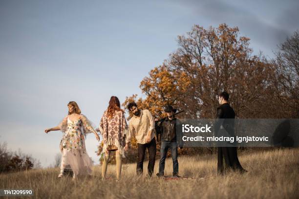 Group Of Weird People On Meadow Stock Photo - Download Image Now - Dancing, Outdoors, Psychedelic
