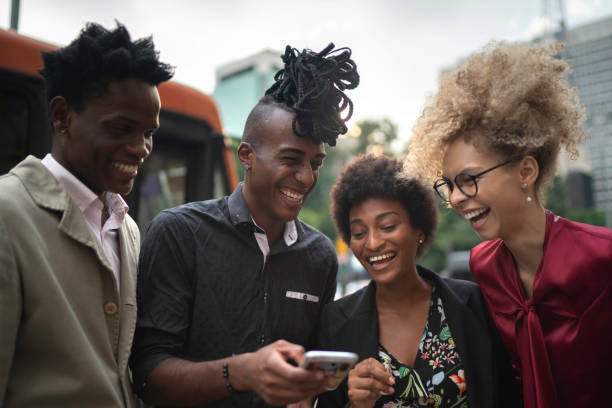 istock Business colleagues having fun using mobile on the city 1141209660