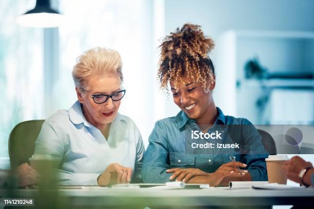 Confident Female Expertise Planning New Project Stock Photo - Download Image Now - 35-39 Years, 70-79 Years, Active Seniors