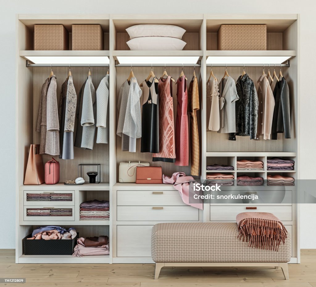 modern wooden wardrobe with women clothes hanging on rail in walk in closet design interior, 3d rendering Closet Stock Photo