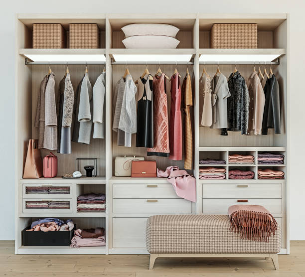 modern wooden wardrobe with women clothes hanging on rail in walk in closet design interior, 3d rendering modern wooden wardrobe with women clothes hanging on rail in walk in closet design interior, 3d rendering tidy room stock pictures, royalty-free photos & images