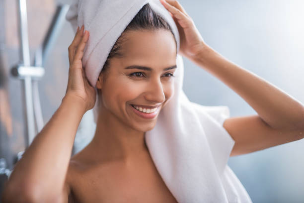 istock Satisfied woman holding head with hands 1141213090