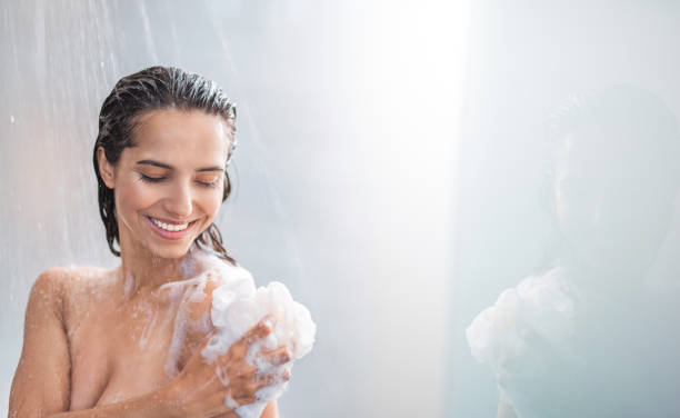 istock Happy girl taking shower with gel 1141213108