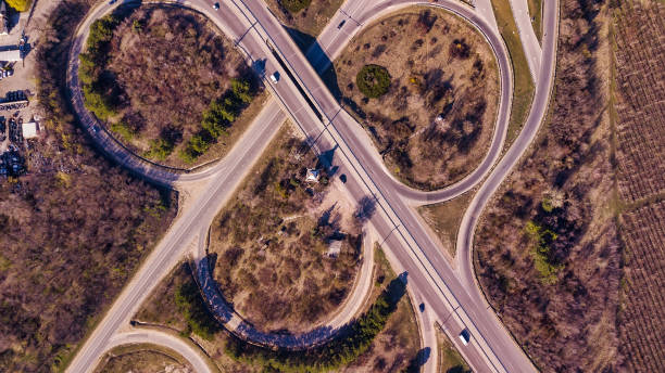 istock Aerial top down view of interchange road junction traffic. 1141213200