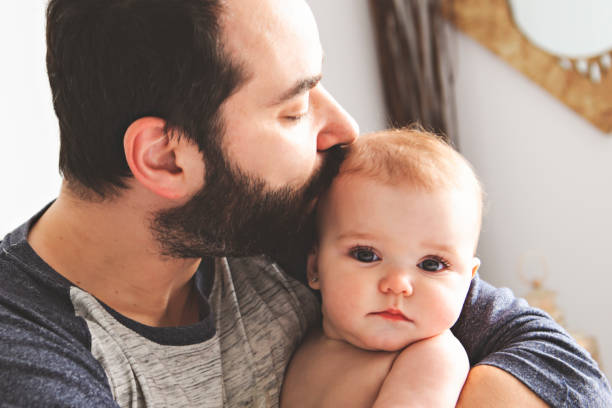istock A Nice father with baby on bed 1141213564