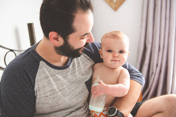 istock A Nice father with baby on bed 1141213590
