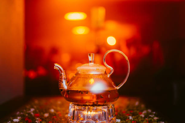 istock green tea brewed in a transparent teapot is on the table in a cafe 1141213629