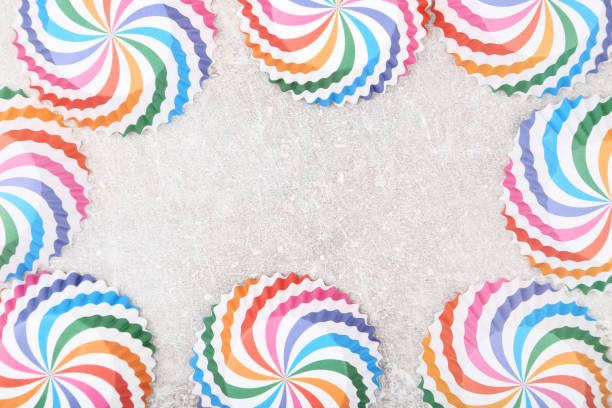 istock Colorful cupcake cases on gray background 1141213761