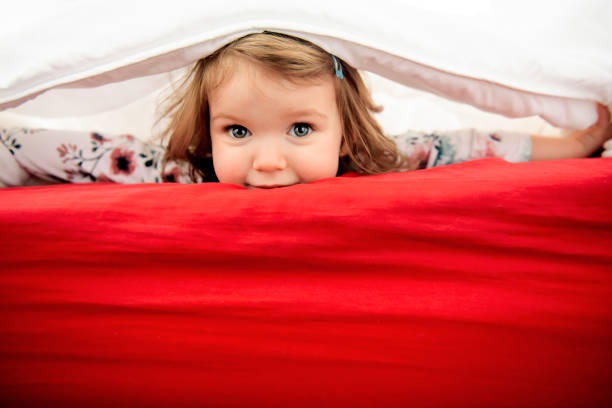 istock A child girl having fun on bedroom 1141213856