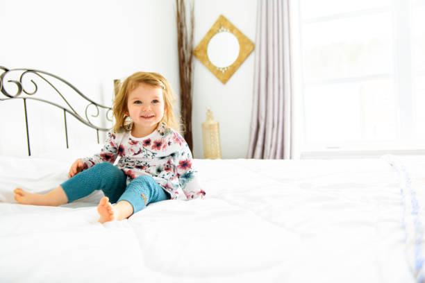 istock A child girl having fun on bedroom 1141213919
