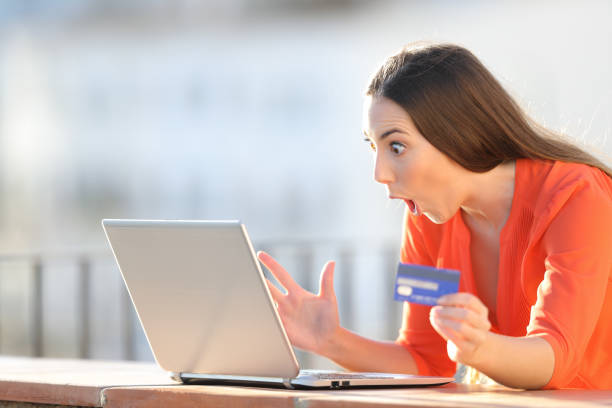 istock Amazed buyer finding online offers on laptop 1141215001
