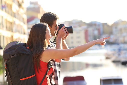 Backpackers taking photos on summer vacation