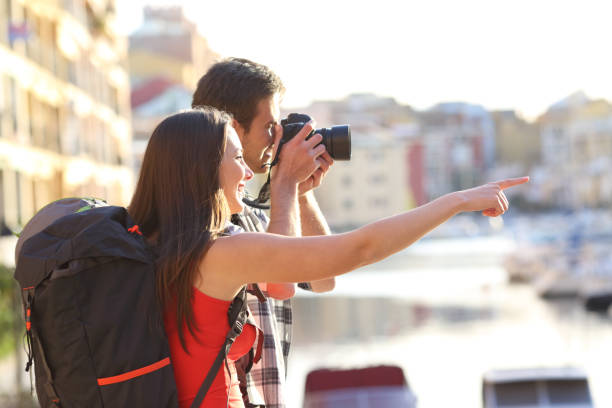 backpackers taking photos on summer vacation - sign camera travel hiking imagens e fotografias de stock