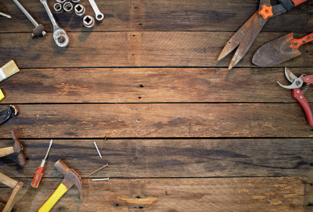 istock tools on a dark wooden table. Place for the text 1141215671