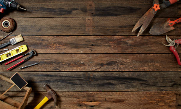 istock tools on a dark wooden table. Place for the text 1141215700