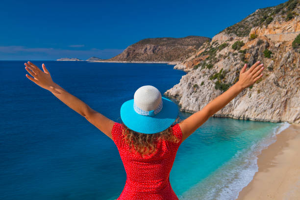 istock Happy woman at beach on summer 1141219227
