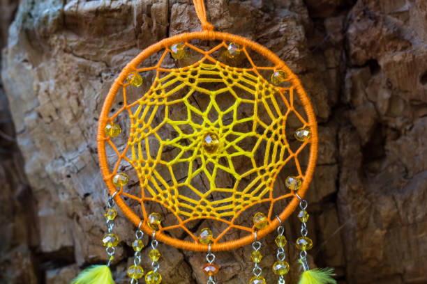 istock Handmade dream catcher with feathers threads and beads rope hanging 1141219302
