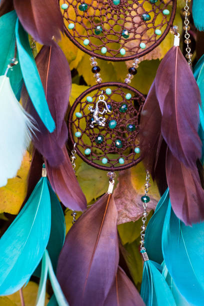 istock Handmade dream catcher with feathers threads and beads rope hanging 1141219337