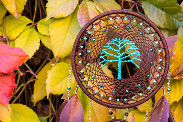 istock Handmade dream catcher with feathers threads and beads rope hanging 1141219342