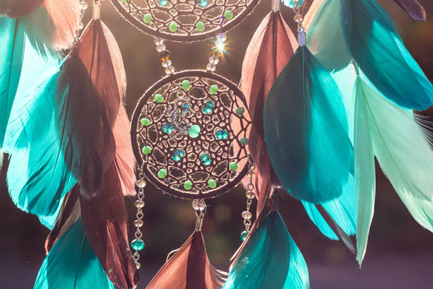 istock Handmade dream catcher with feathers threads and beads rope hanging 1141219353