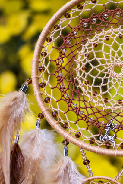 istock Handmade dream catcher with feathers threads and beads rope hanging 1141219720