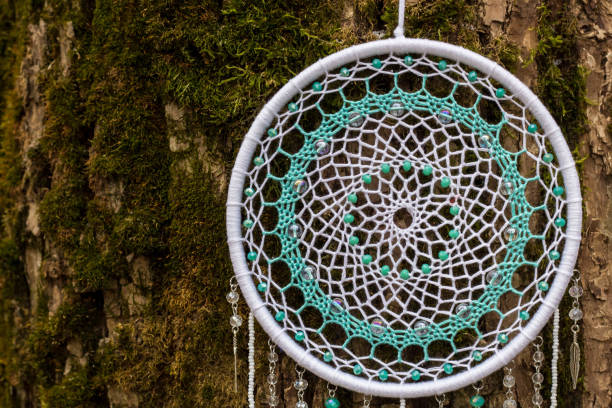istock Handmade dream catcher with feathers threads and beads rope hanging 1141219765