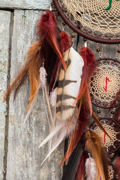 istock Handmade dream catcher with feathers threads and beads rope hanging 1141219804