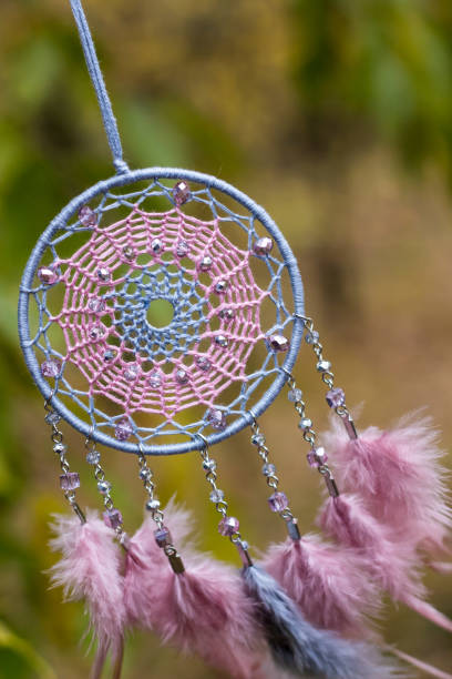 istock Handmade dream catcher with feathers threads and beads rope hanging 1141219909