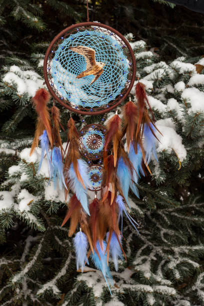 istock Handmade dream catcher with feathers threads and beads rope hanging 1141219939