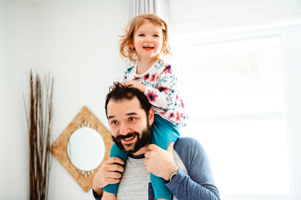 istock A Nice father with girl child on bed 1141220050