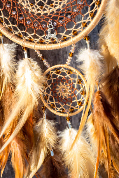 istock Handmade dream catcher with feathers threads and beads rope hanging 1141220169