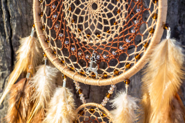 istock Handmade dream catcher with feathers threads and beads rope hanging 1141220170