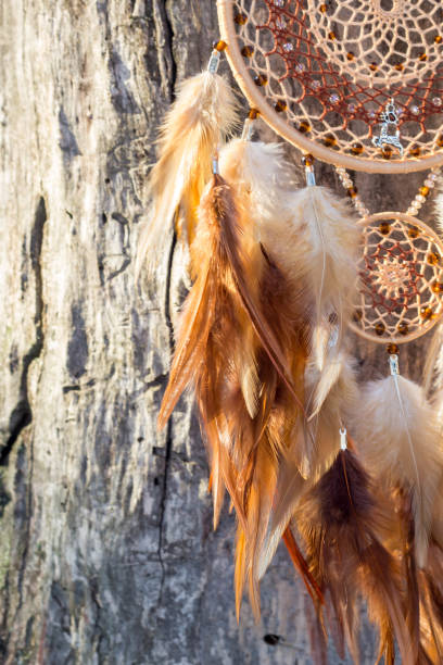 istock Handmade dream catcher with feathers threads and beads rope hanging 1141220177