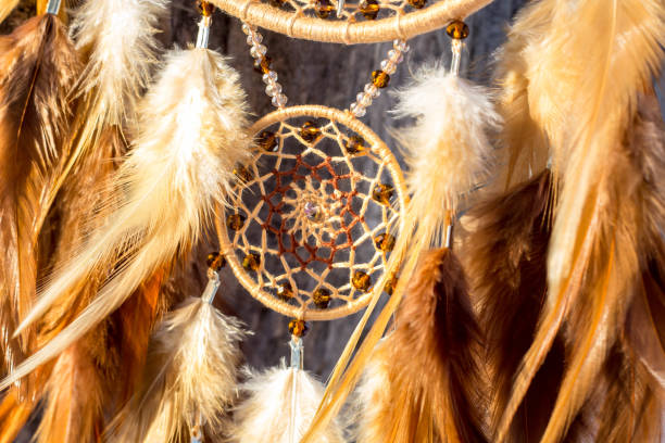 istock Handmade dream catcher with feathers threads and beads rope hanging 1141220181