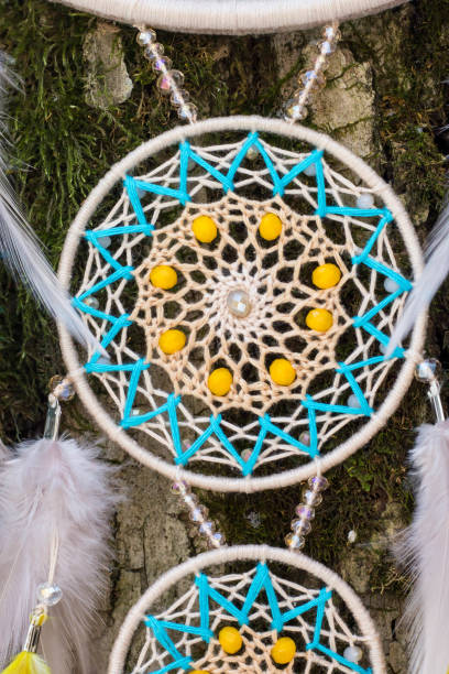 istock Handmade dream catcher with feathers threads and beads rope hanging 1141220237