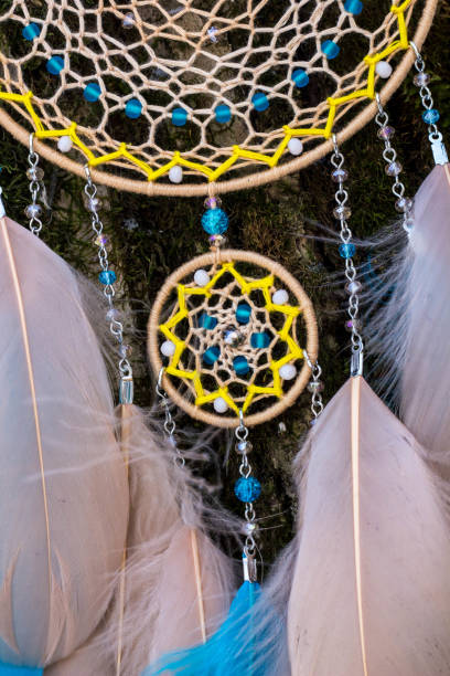 istock Handmade dream catcher with feathers threads and beads rope hanging 1141220293