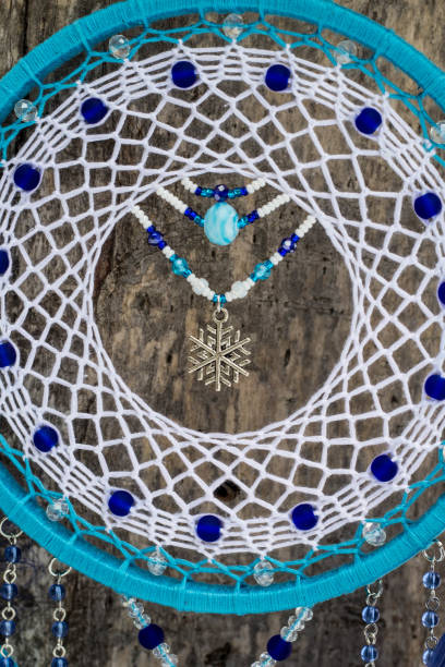 istock Handmade dream catcher with feathers threads and beads rope hanging 1141220355