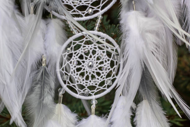 istock Handmade dream catcher with feathers threads and beads rope hanging 1141220359