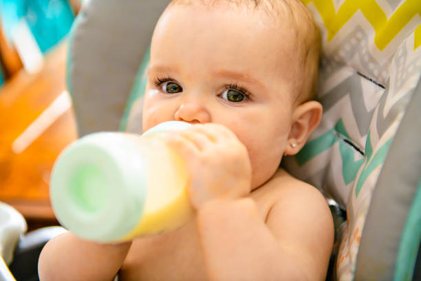 istock A Little baby drinking milk and making a mess 1141220538
