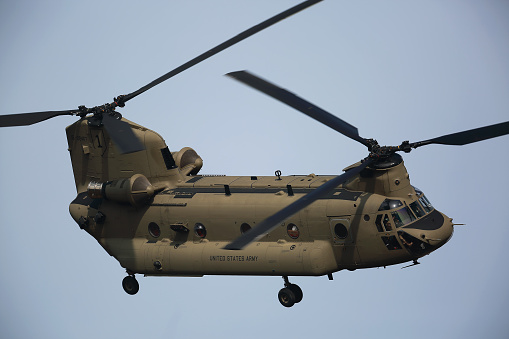 A U.S. Army transport helicopter in low-altitude flight.