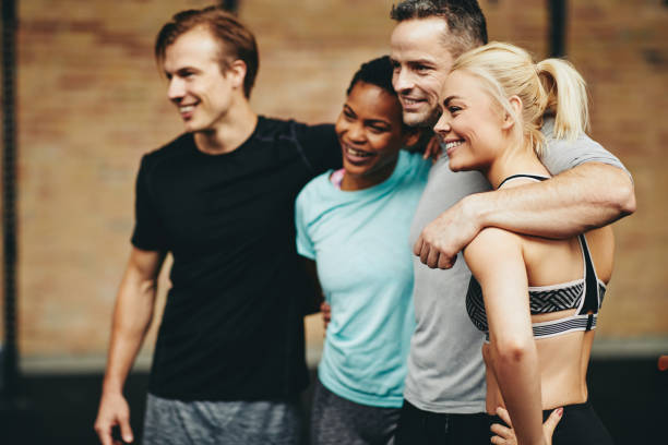 istock Diverse friends smiling in a gym after working out class 1141221870