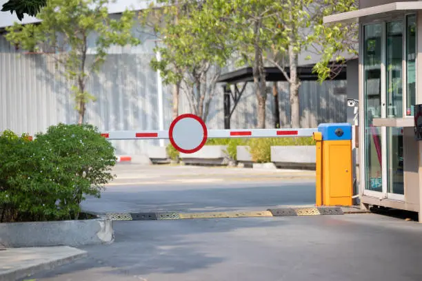 car park barrier with recoding CCTV camera, automatic entry system.